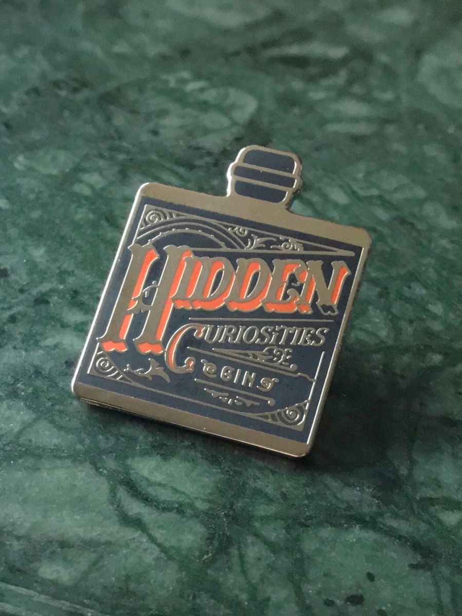 Hidden Curiosities Gin Badge